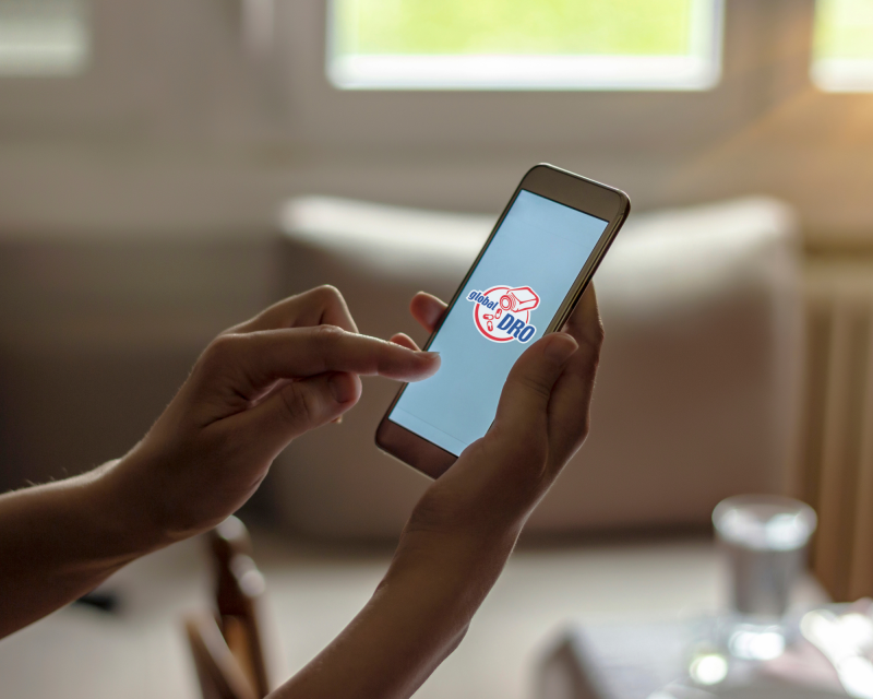 Person searching up Global DRO on their phone